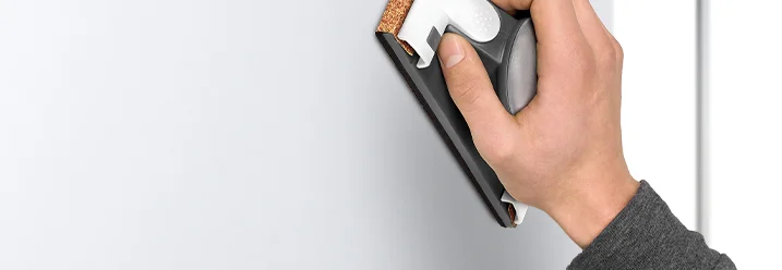 Hand schleift Wand